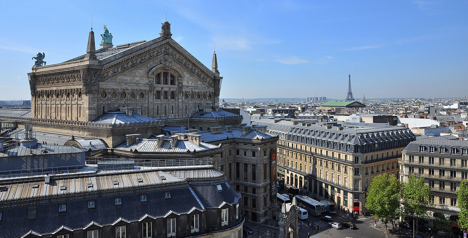 a large building with a tower in the background