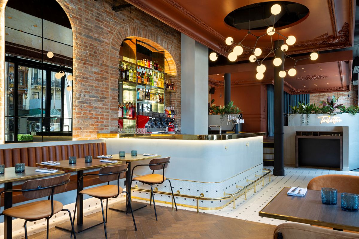 a bar with a counter and chairs