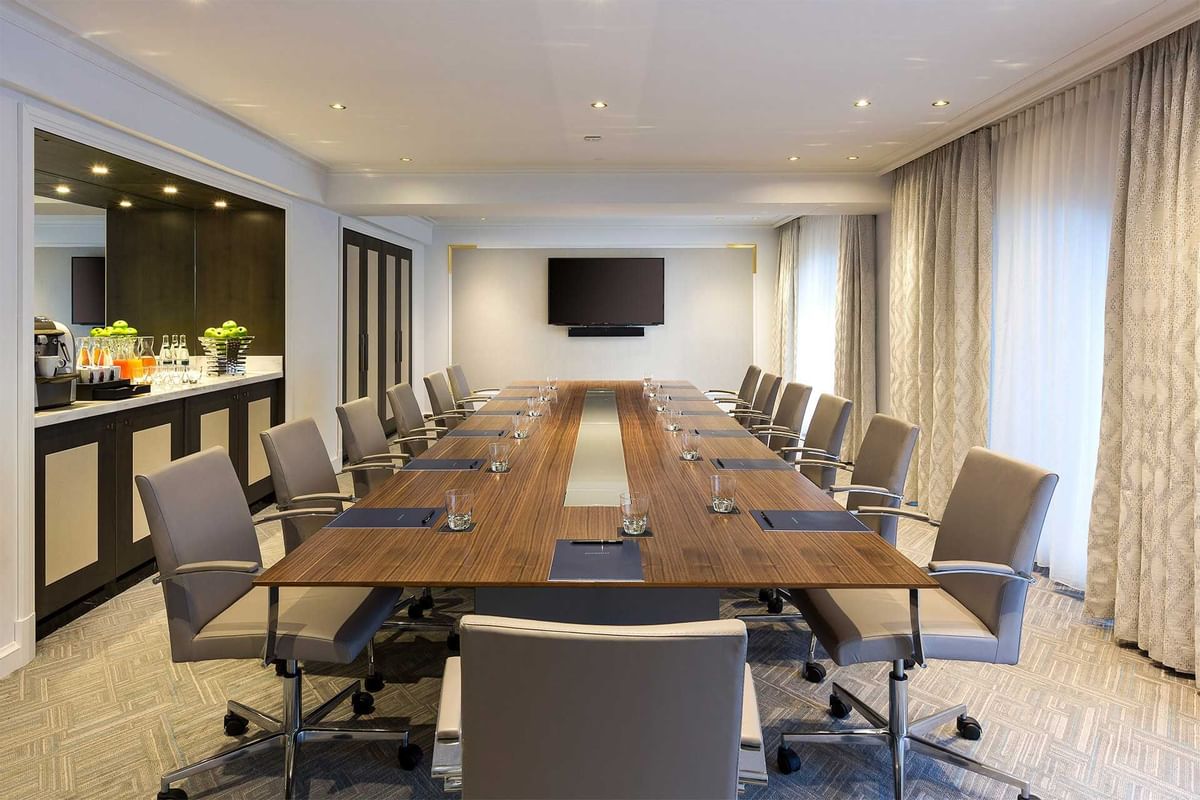 a conference room with a table and chairs