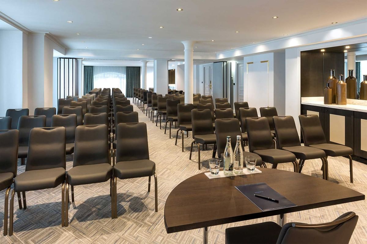 a room with many chairs and a table
