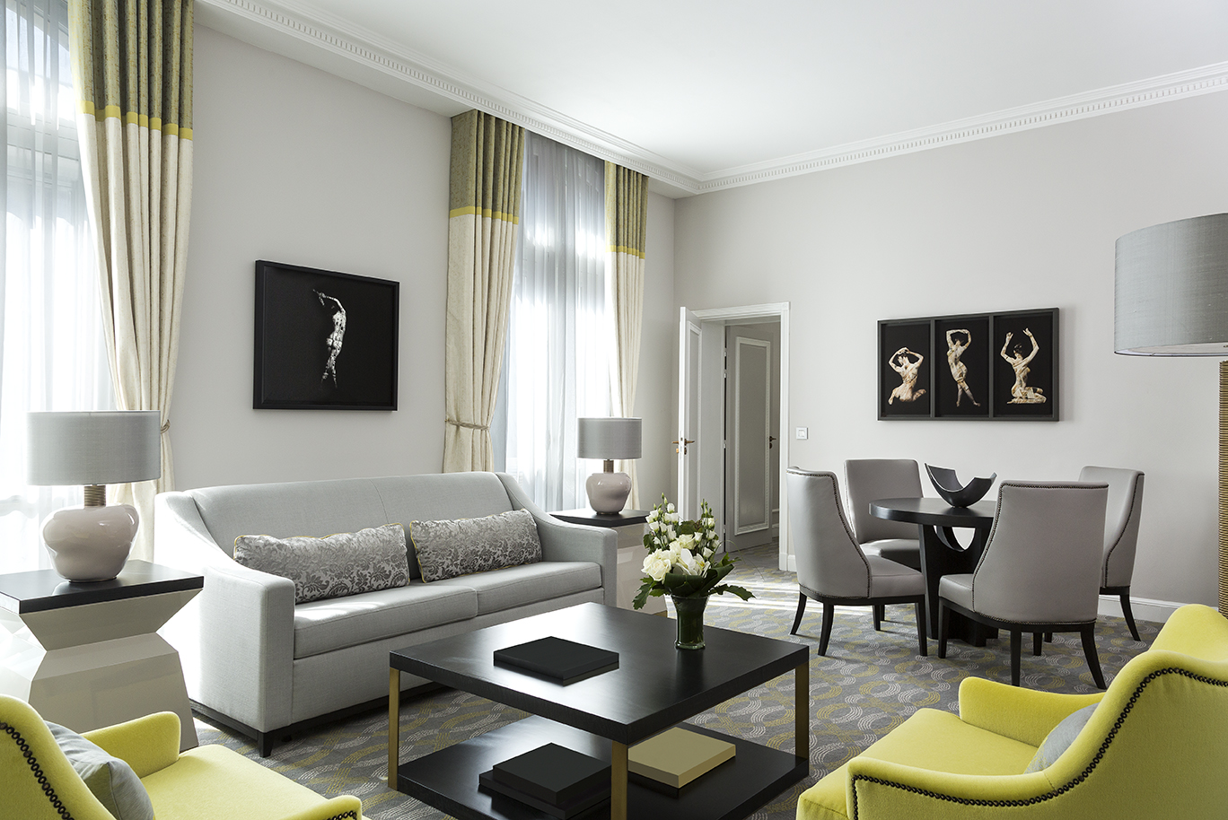 a living room with a couch and chairs