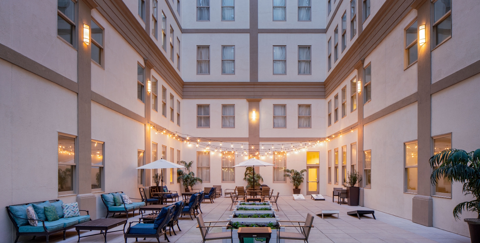 a patio with chairs and umbrellas