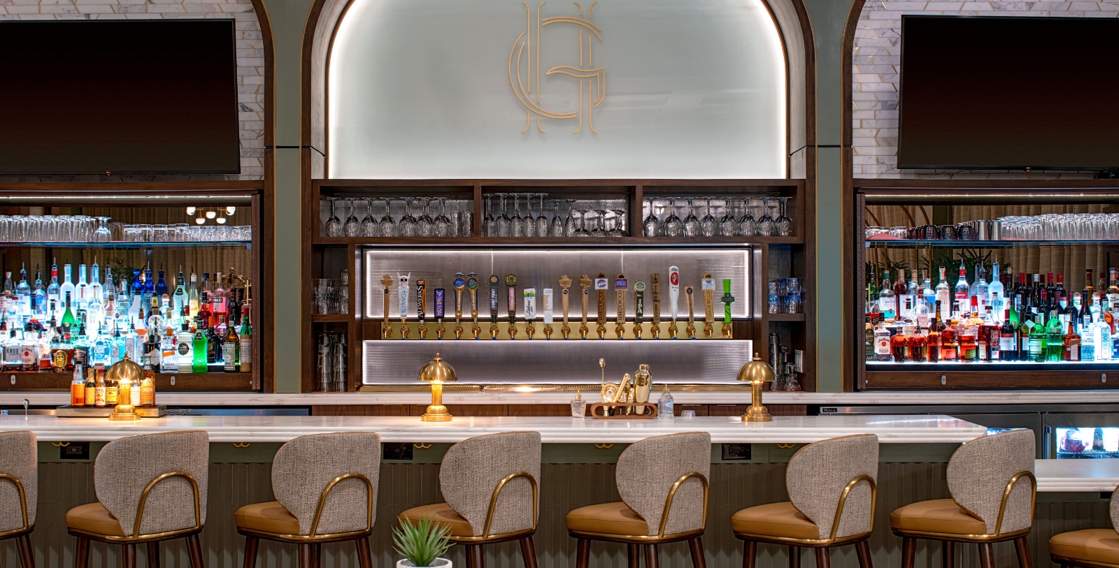 a bar with a row of beer taps
