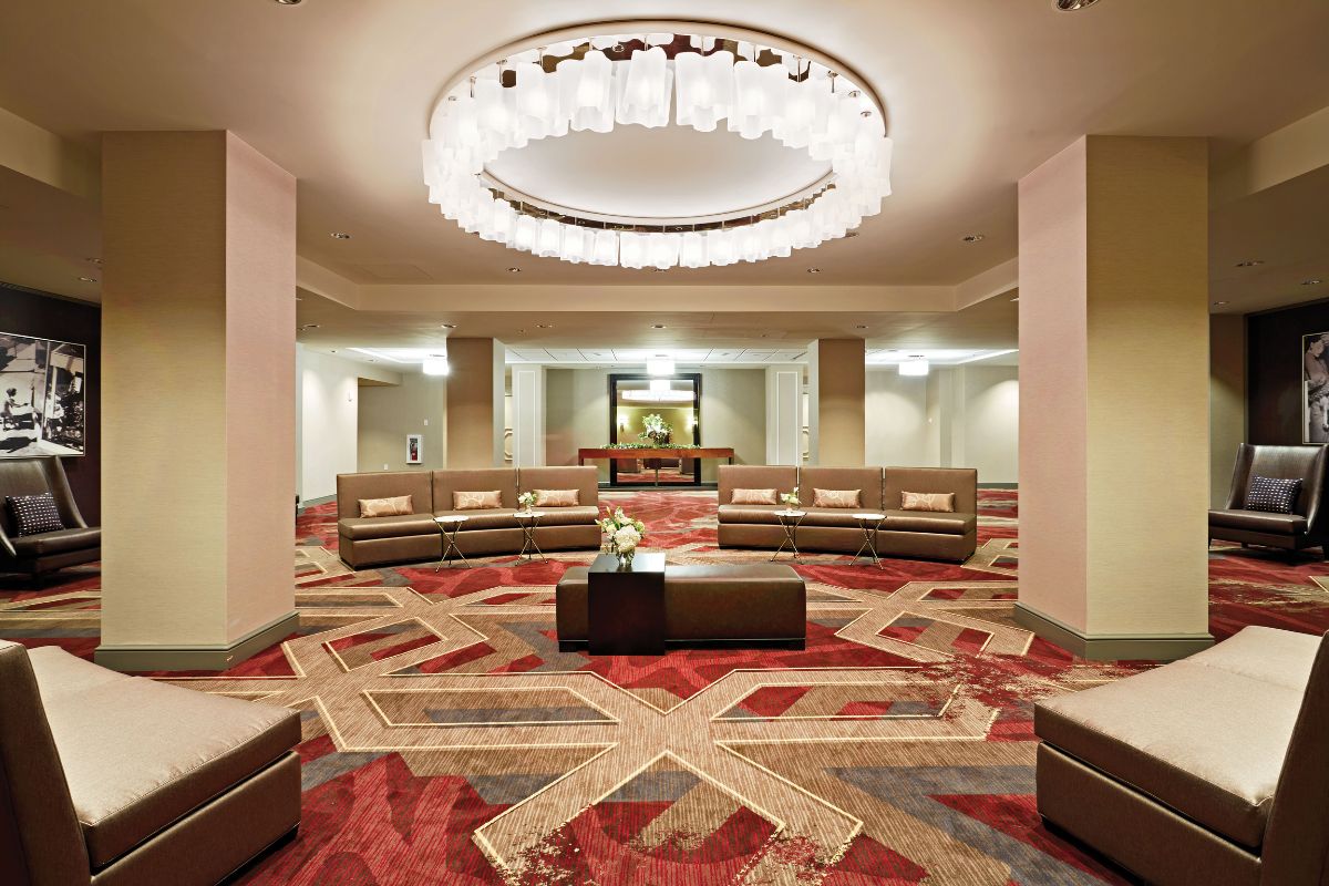 a large room with couches and a chandelier