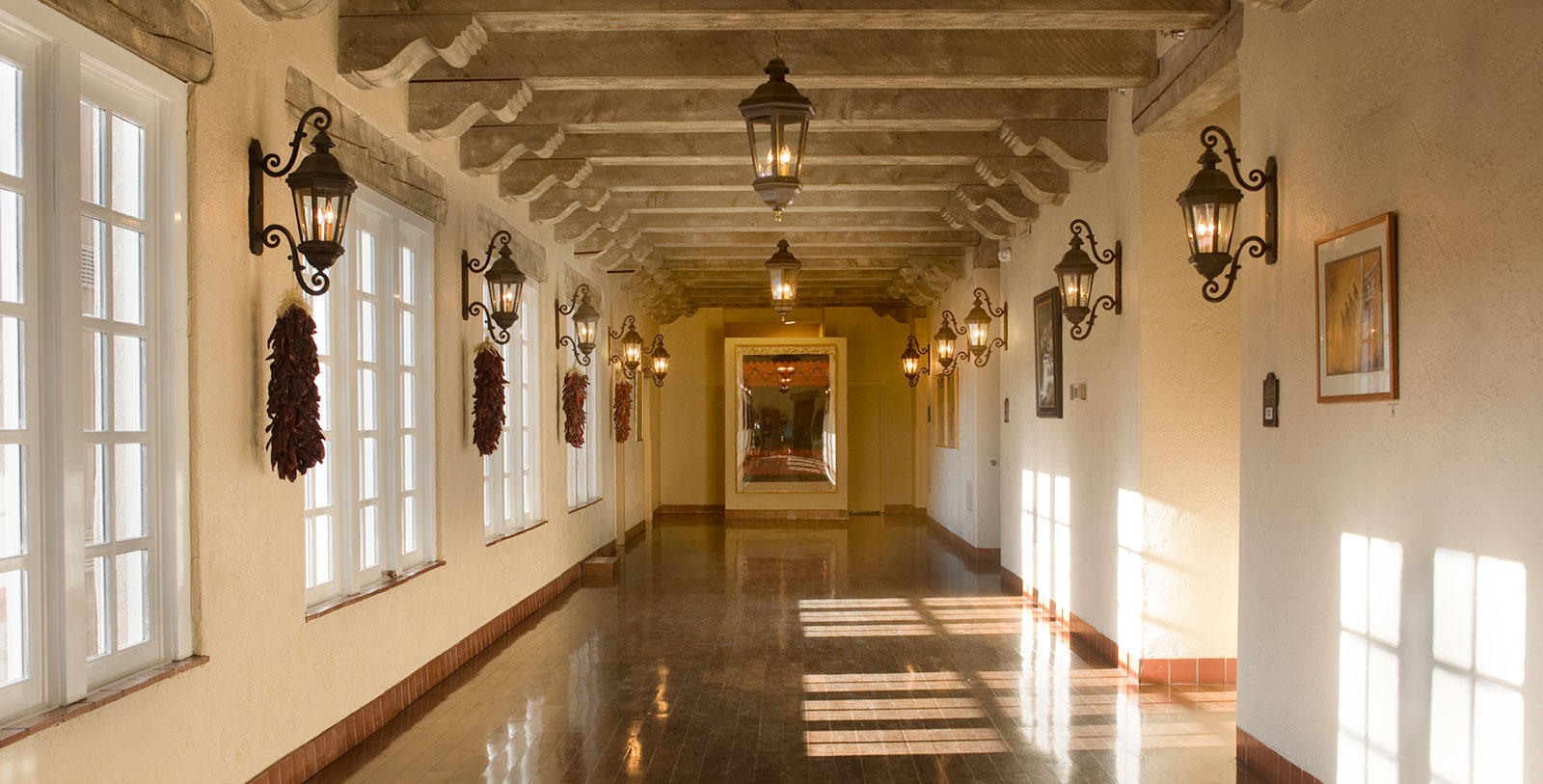 a hallway with lights and a mirror