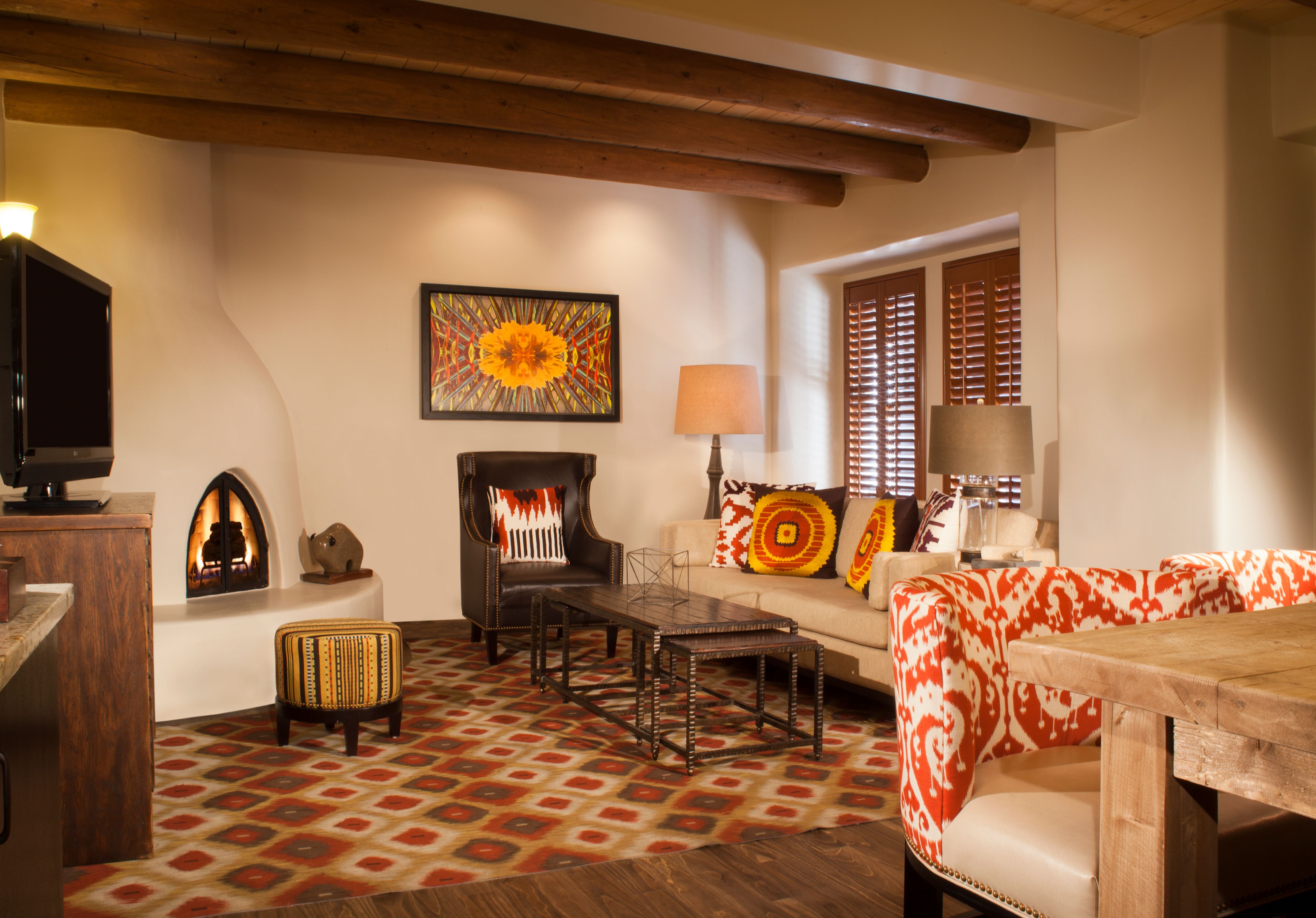 a living room with a fireplace and couches
