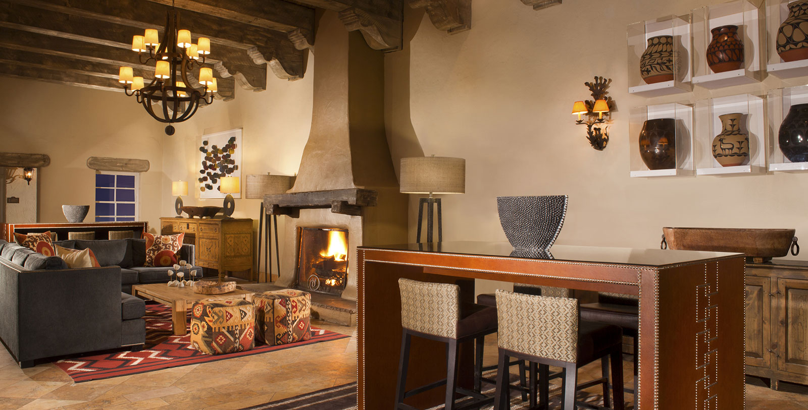 a room with a table and chairs and a fireplace
