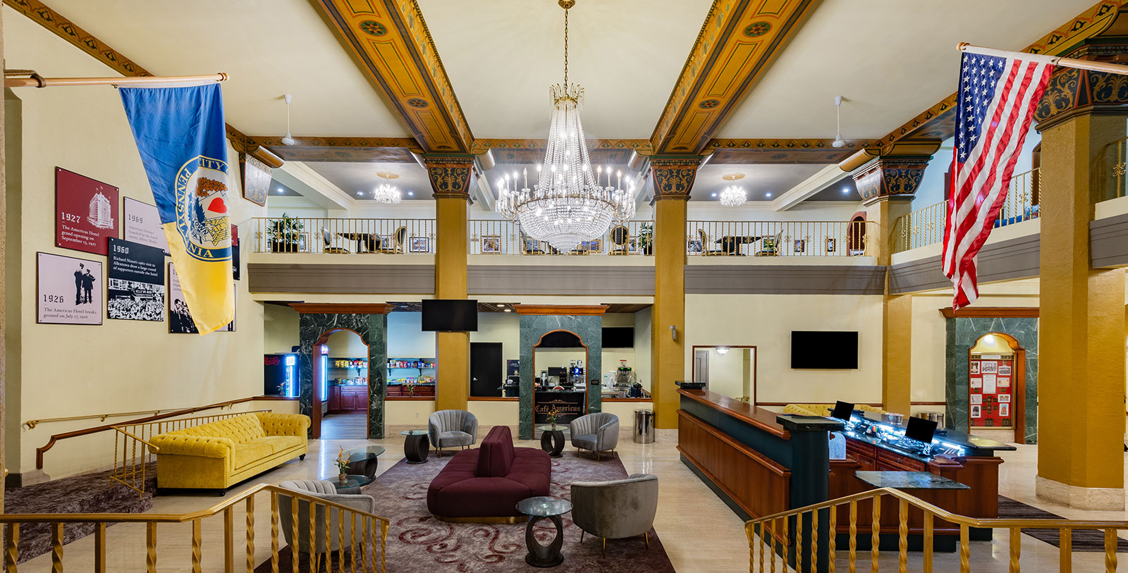 a lobby with a chandelier and a couch