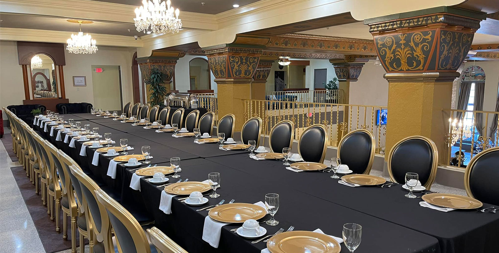 a long table with plates and glasses