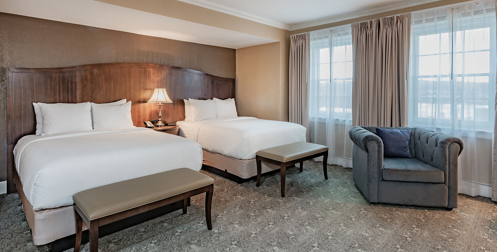 a room with two beds and a couch