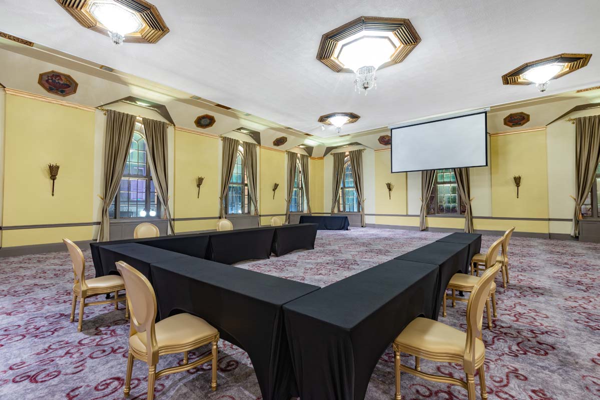 a room with a large table and chairs