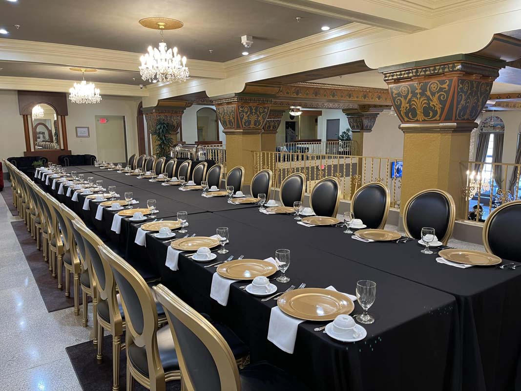 a long table with plates and glasses