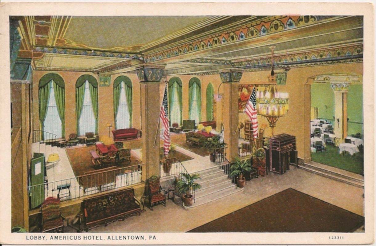 a room with a staircase and a chandelier