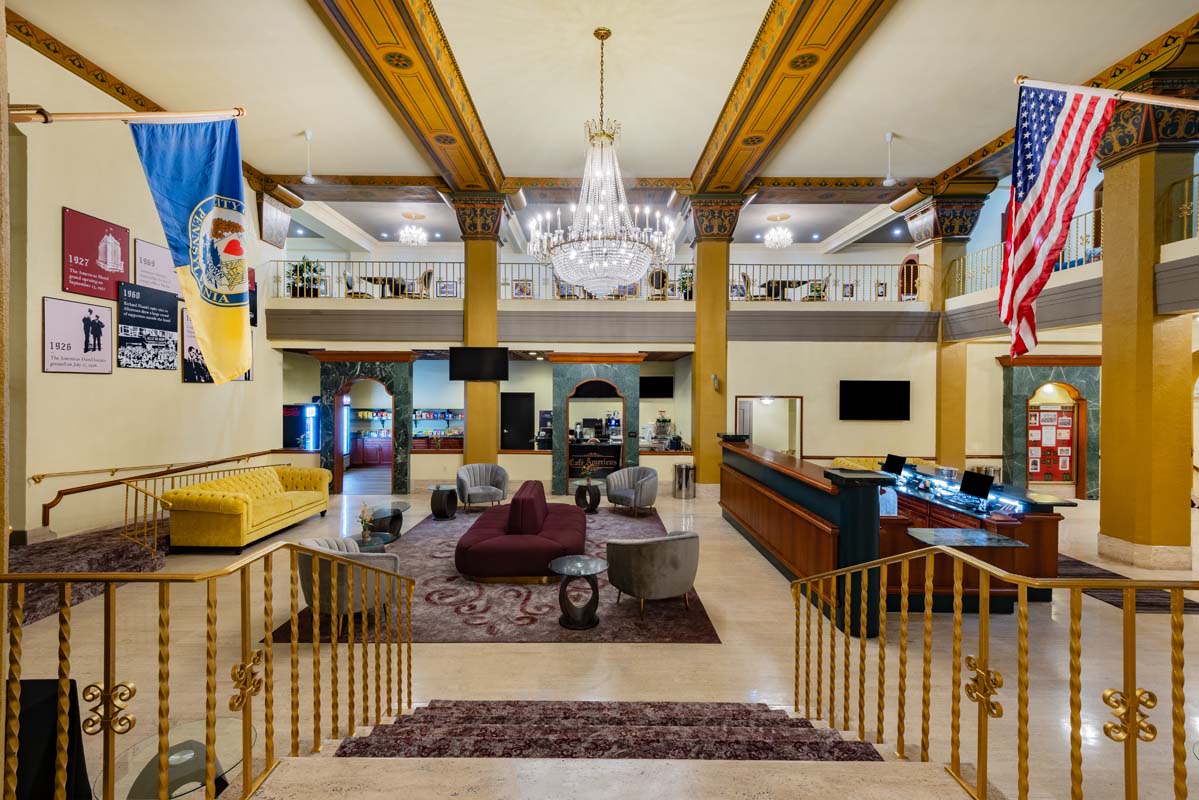 a lobby with a chandelier and a couch