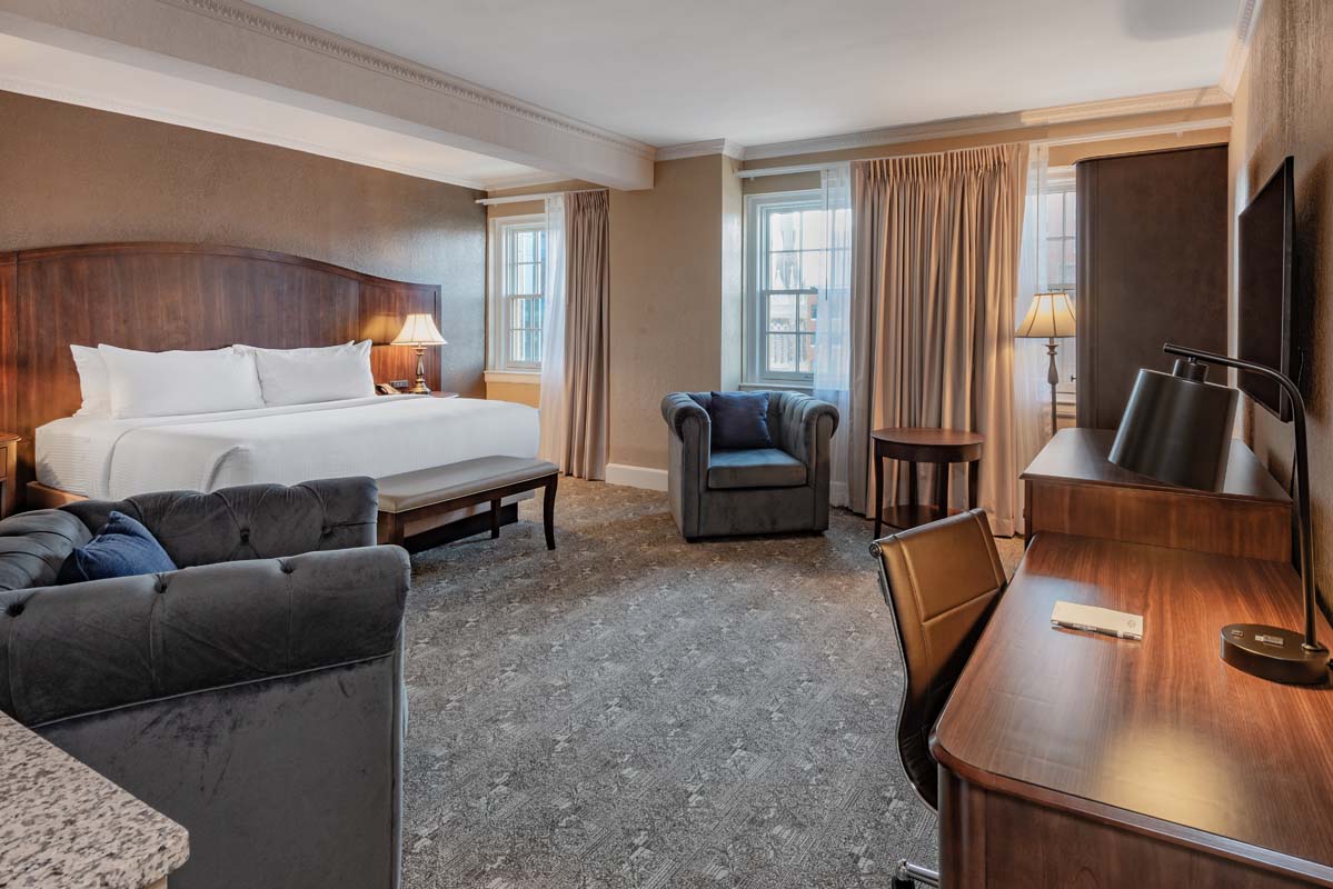 a room with a bed and a desk