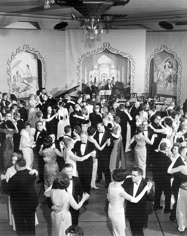 a group of people dancing in a room