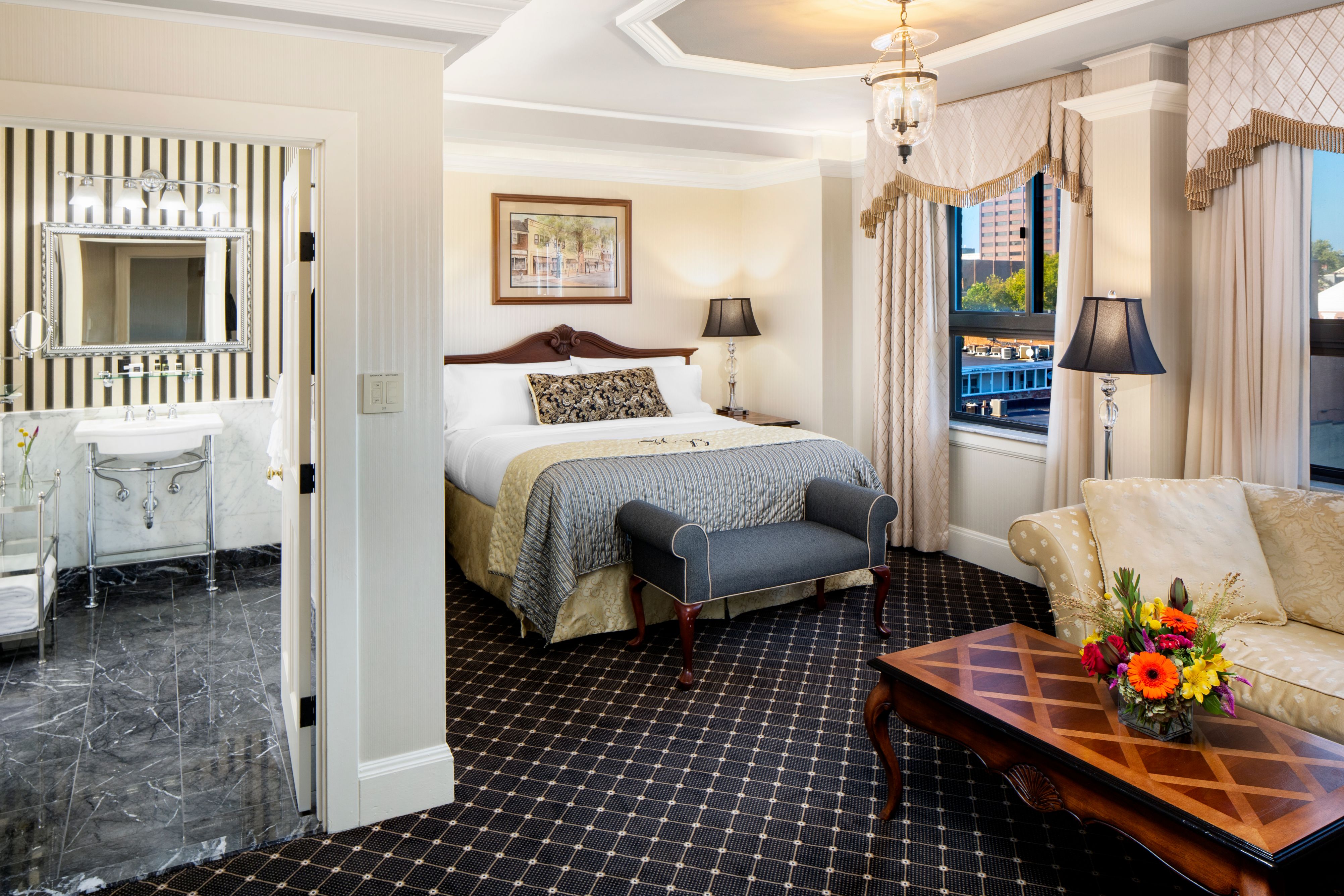 a bedroom with a bed and a couch