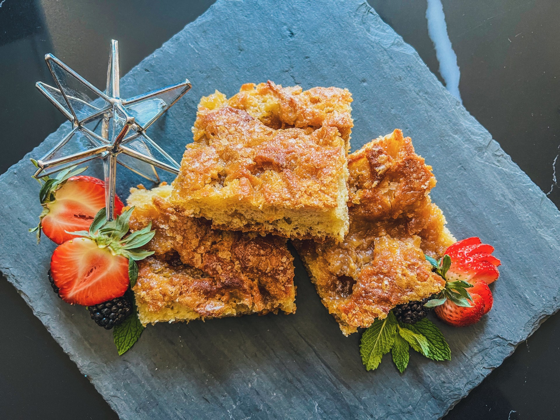 a group of food on a stone plate