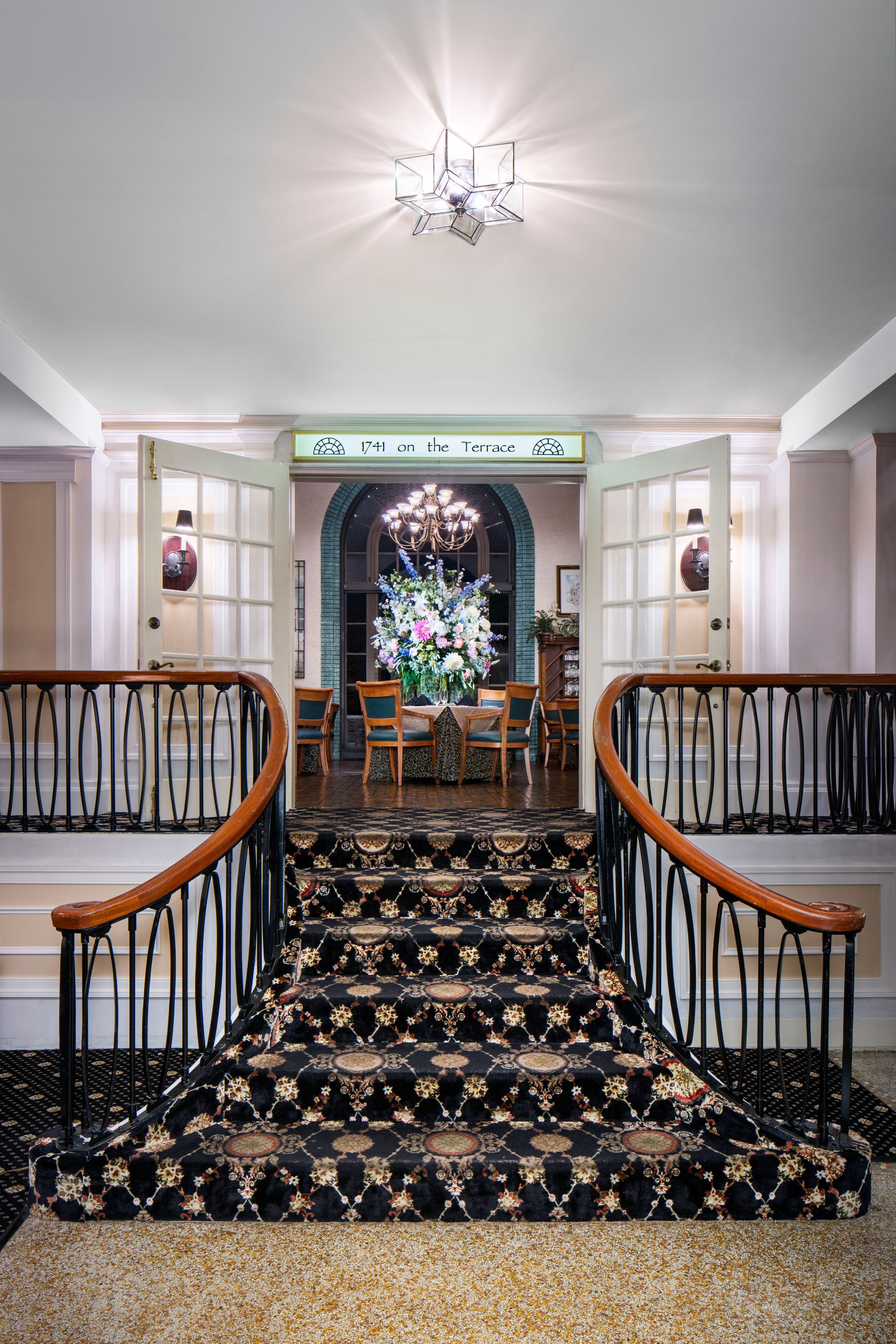 a staircase leading to a dining room