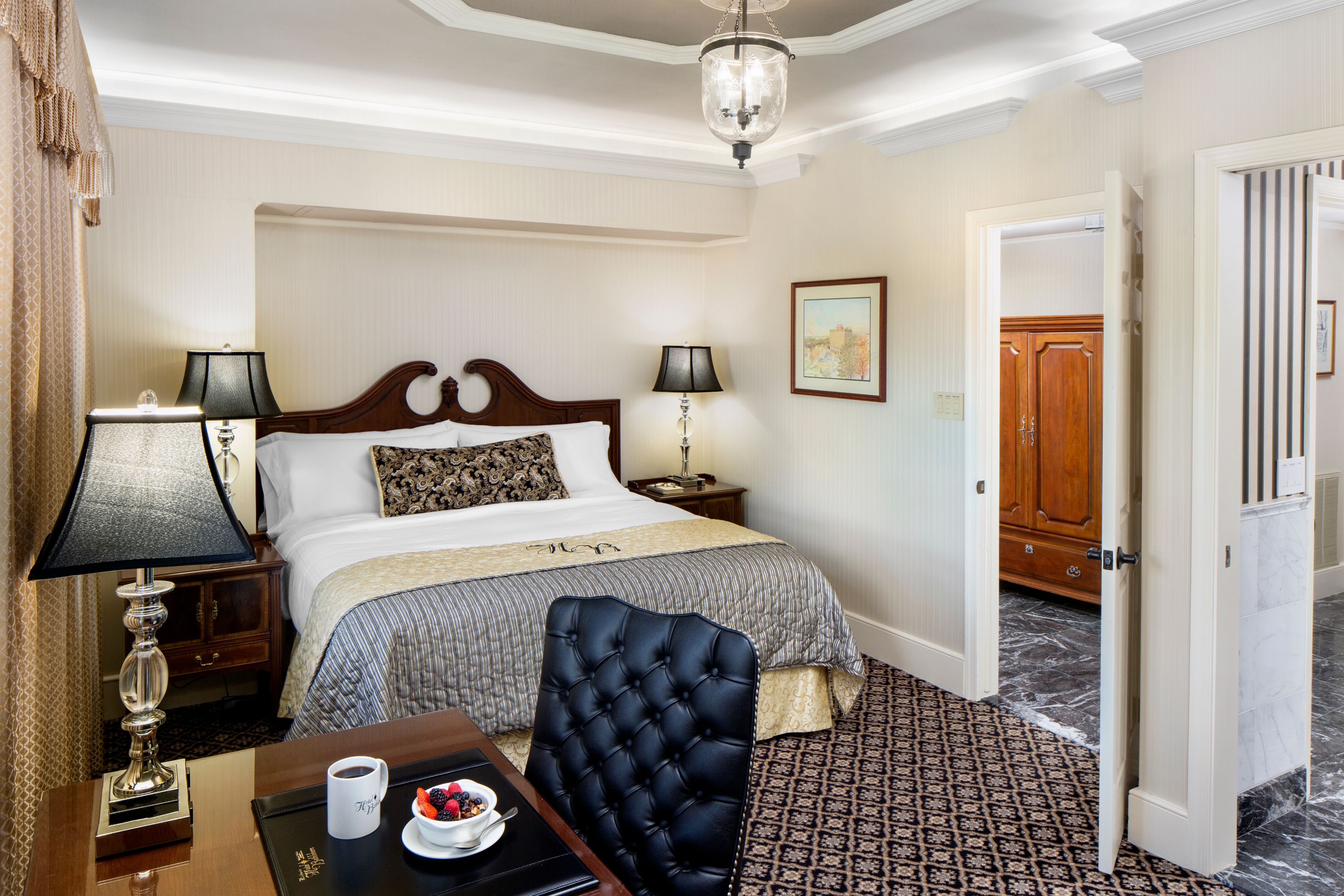 a bedroom with a bed and a table