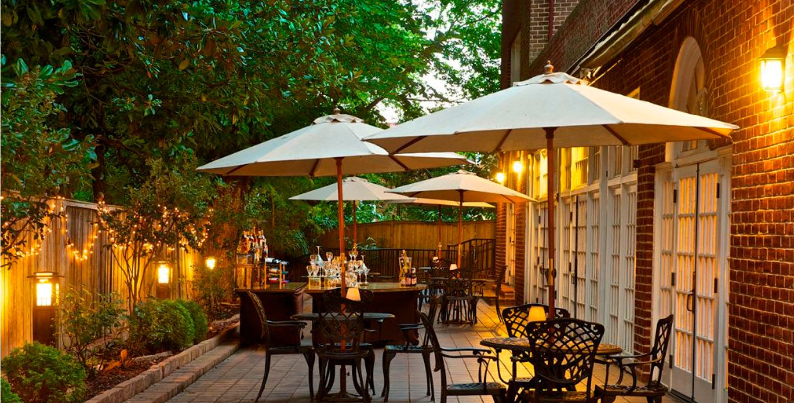 a patio with umbrellas and tables