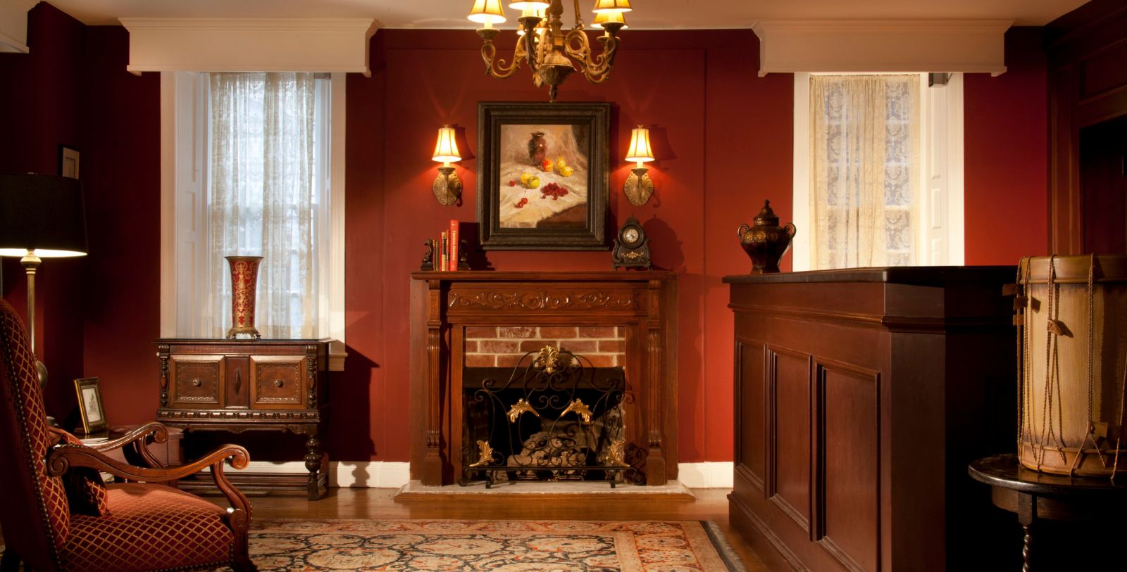 a room with a fireplace and a chandelier