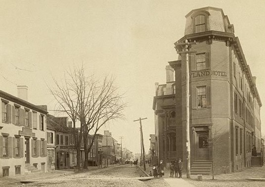 a street with buildings and people