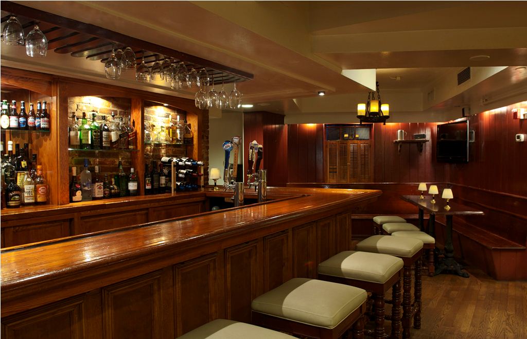 a bar with wine glasses from the ceiling