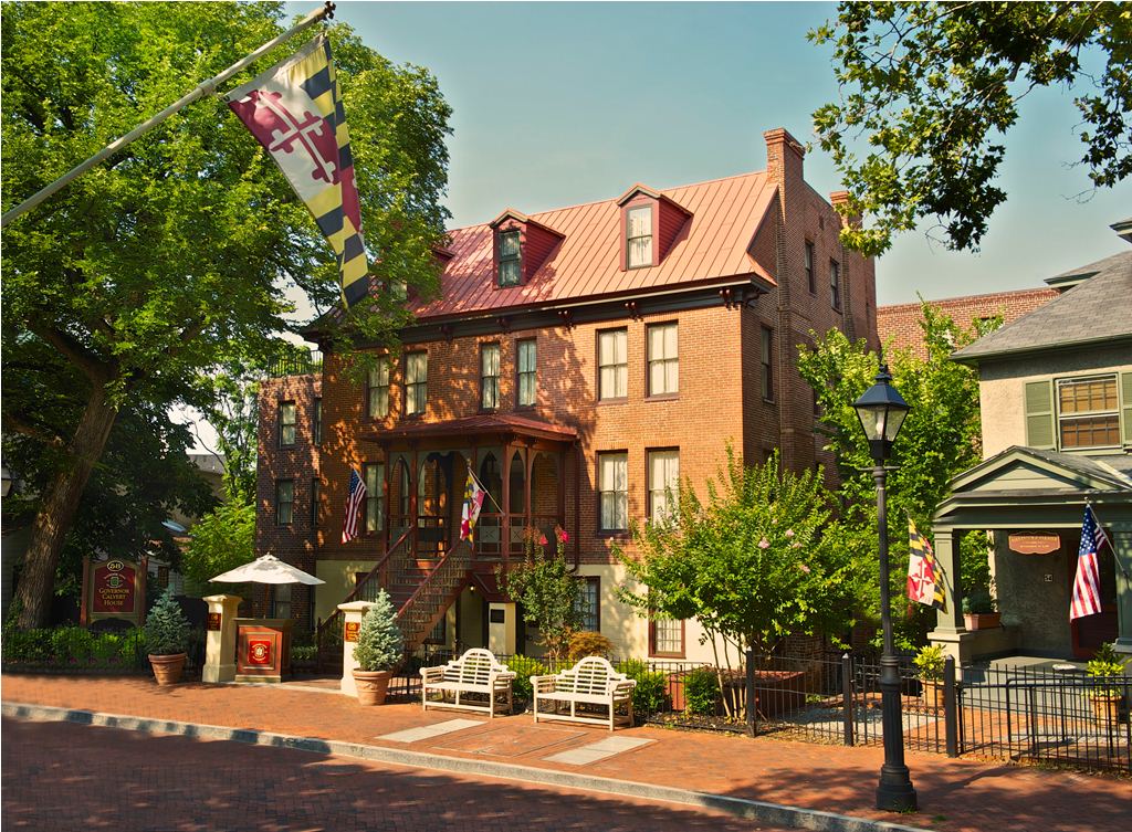 a brick building with a flag on the front
