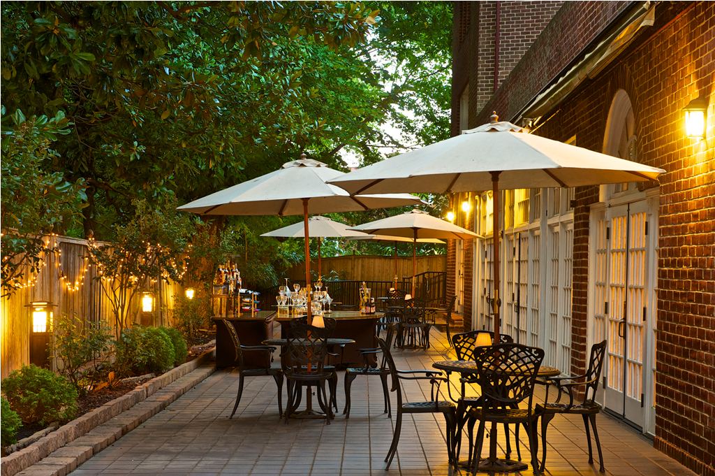 a patio with umbrellas and tables