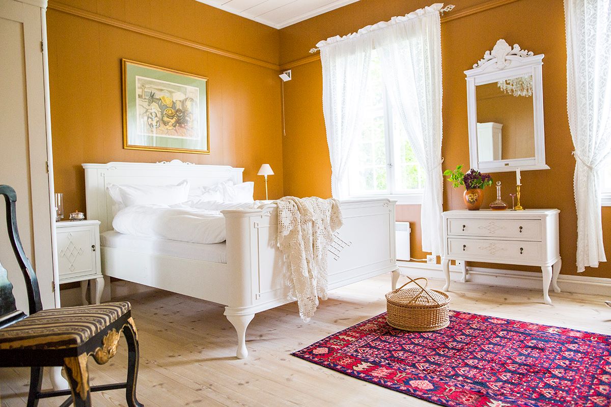 a bedroom with a bed and a rug