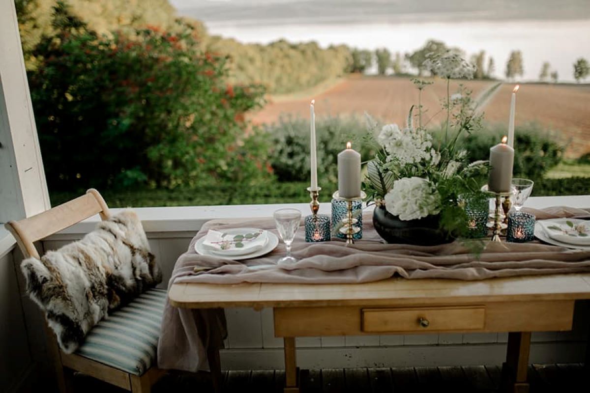 a table with candles and flowers on it