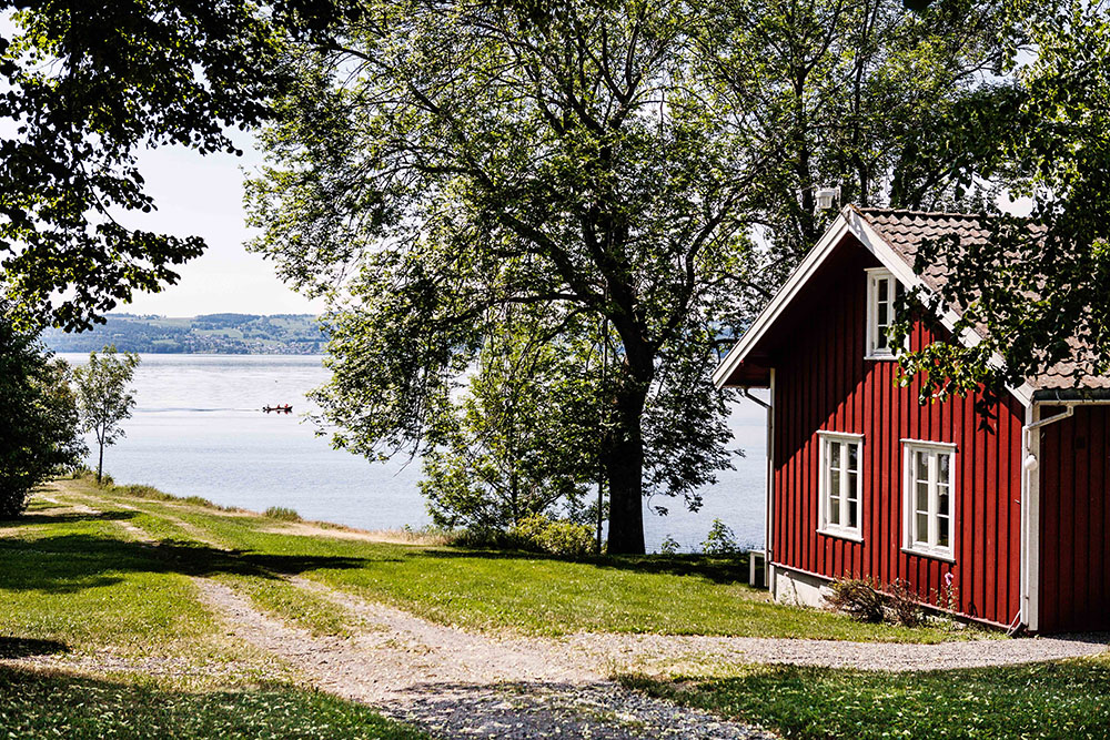 a house next to a body of water