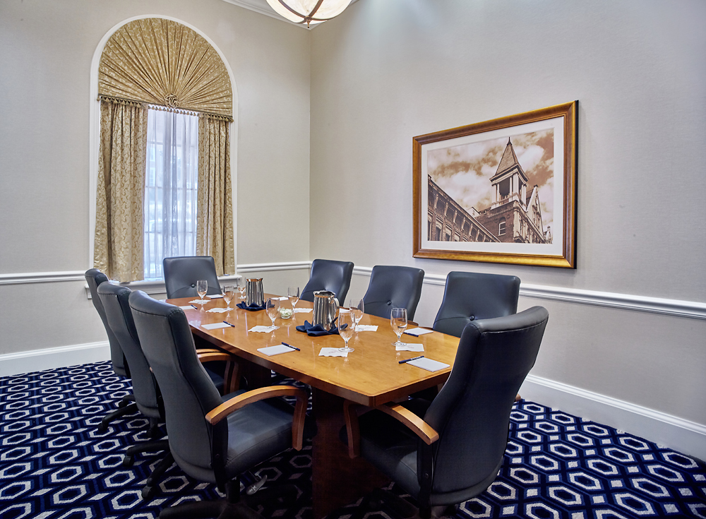 a conference room with a table and chairs
