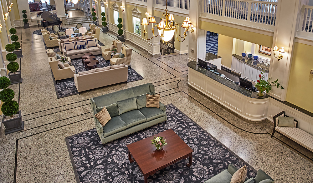 a large lobby with a large sofa and a coffee table
