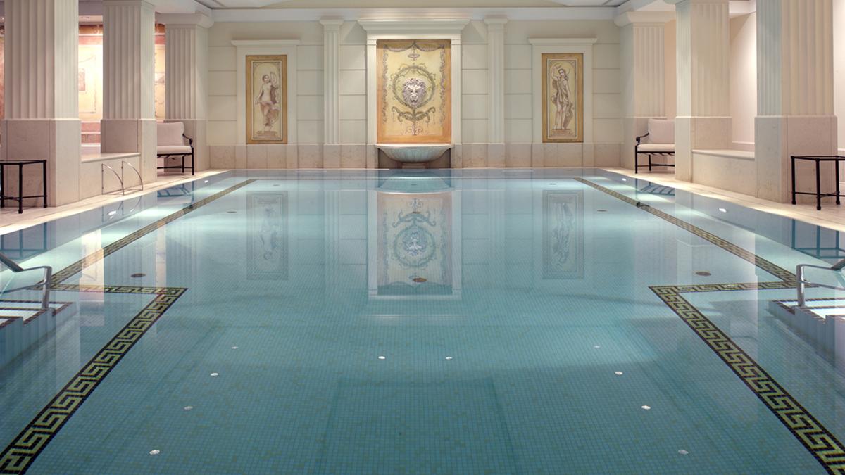a indoor pool with a large fountain