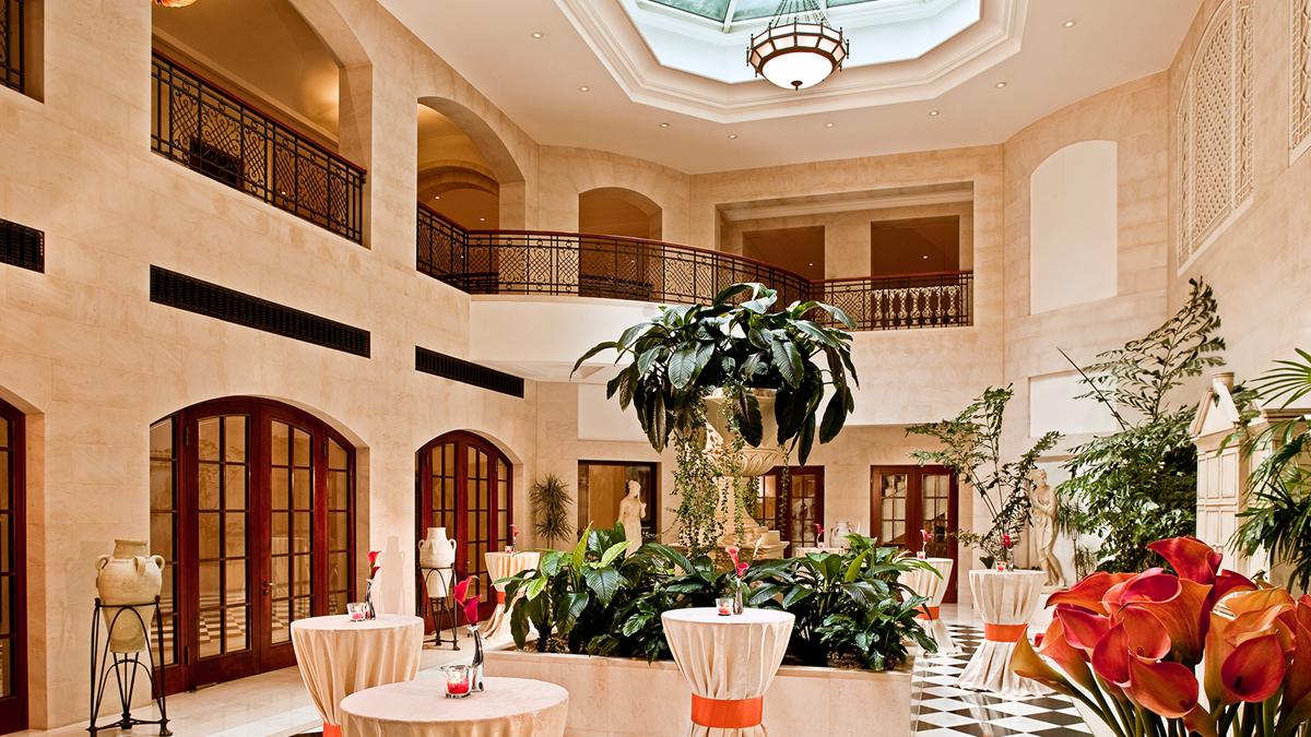 a room with tables and plants