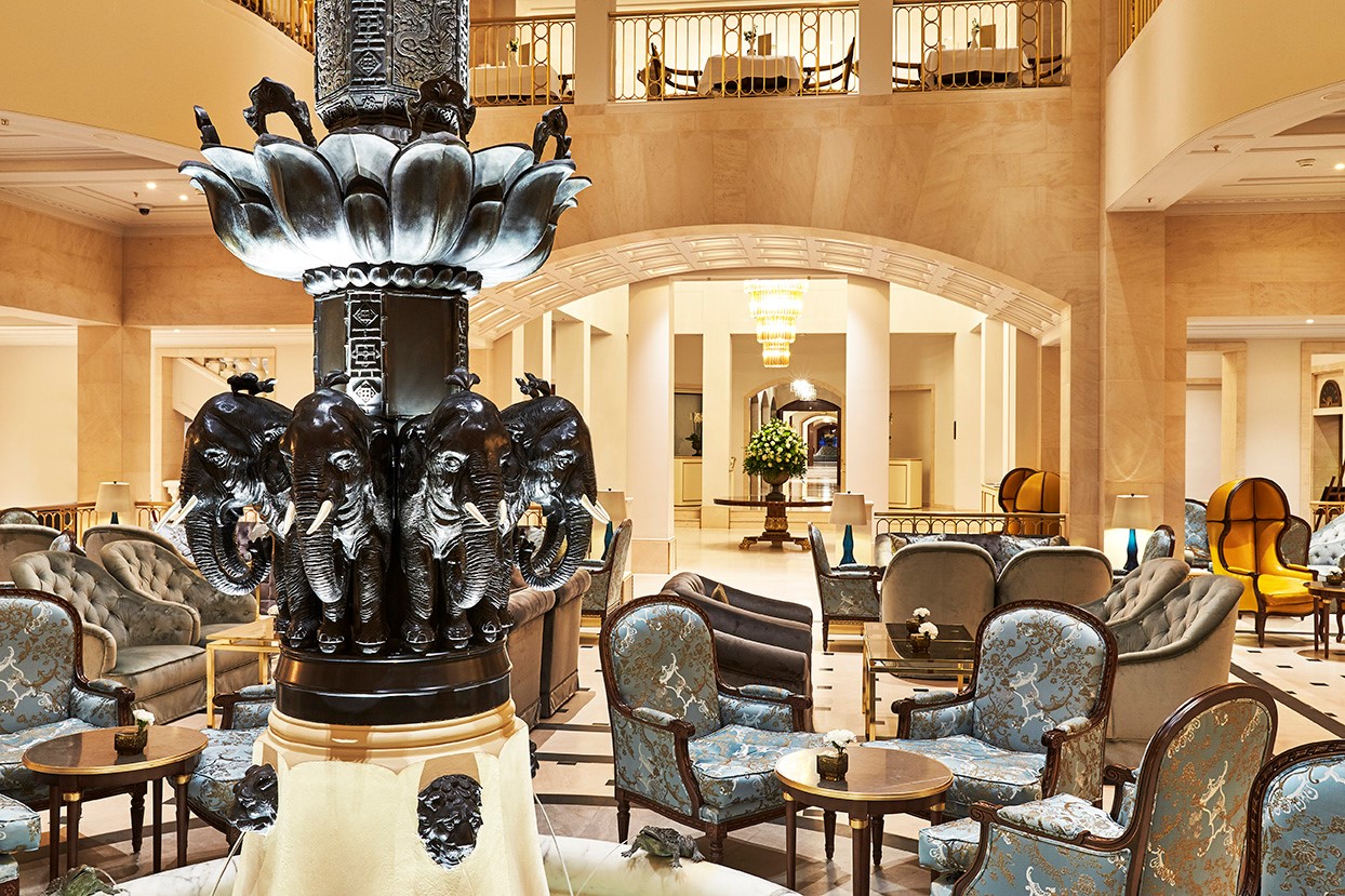 a large room with a large statue of elephants