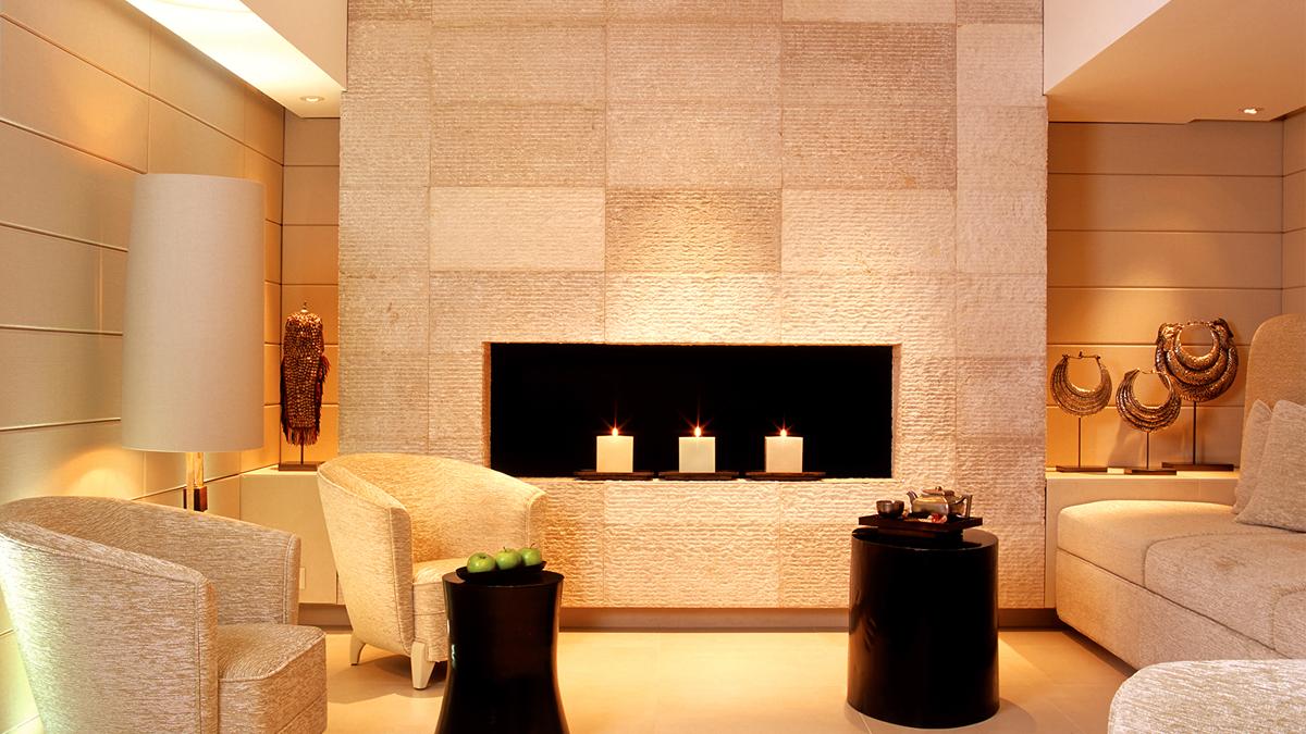 a room with a fireplace and a chair