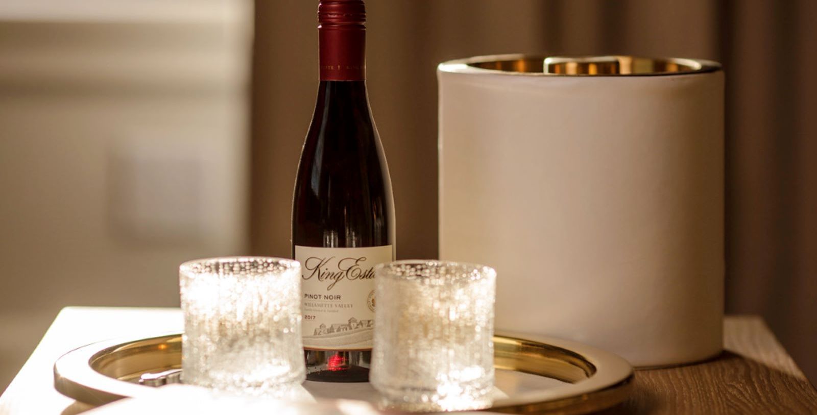 a bottle of wine and two glasses