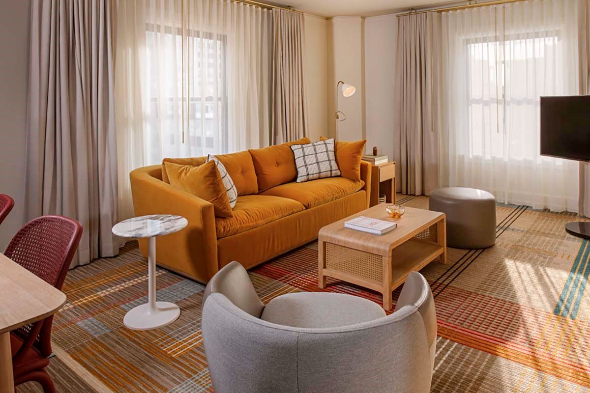 a living room with a couch and a table
