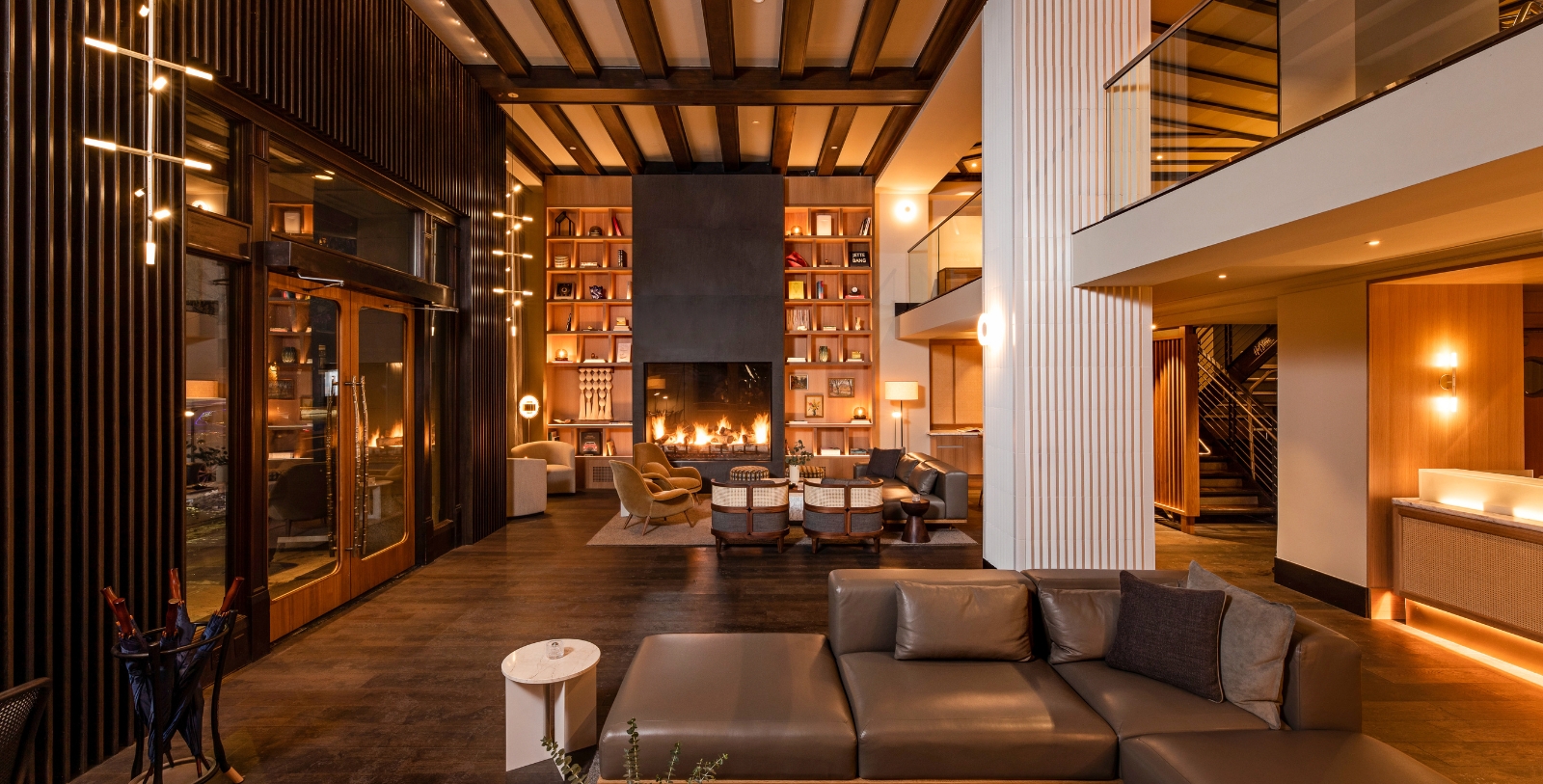 a room with a fireplace and couches