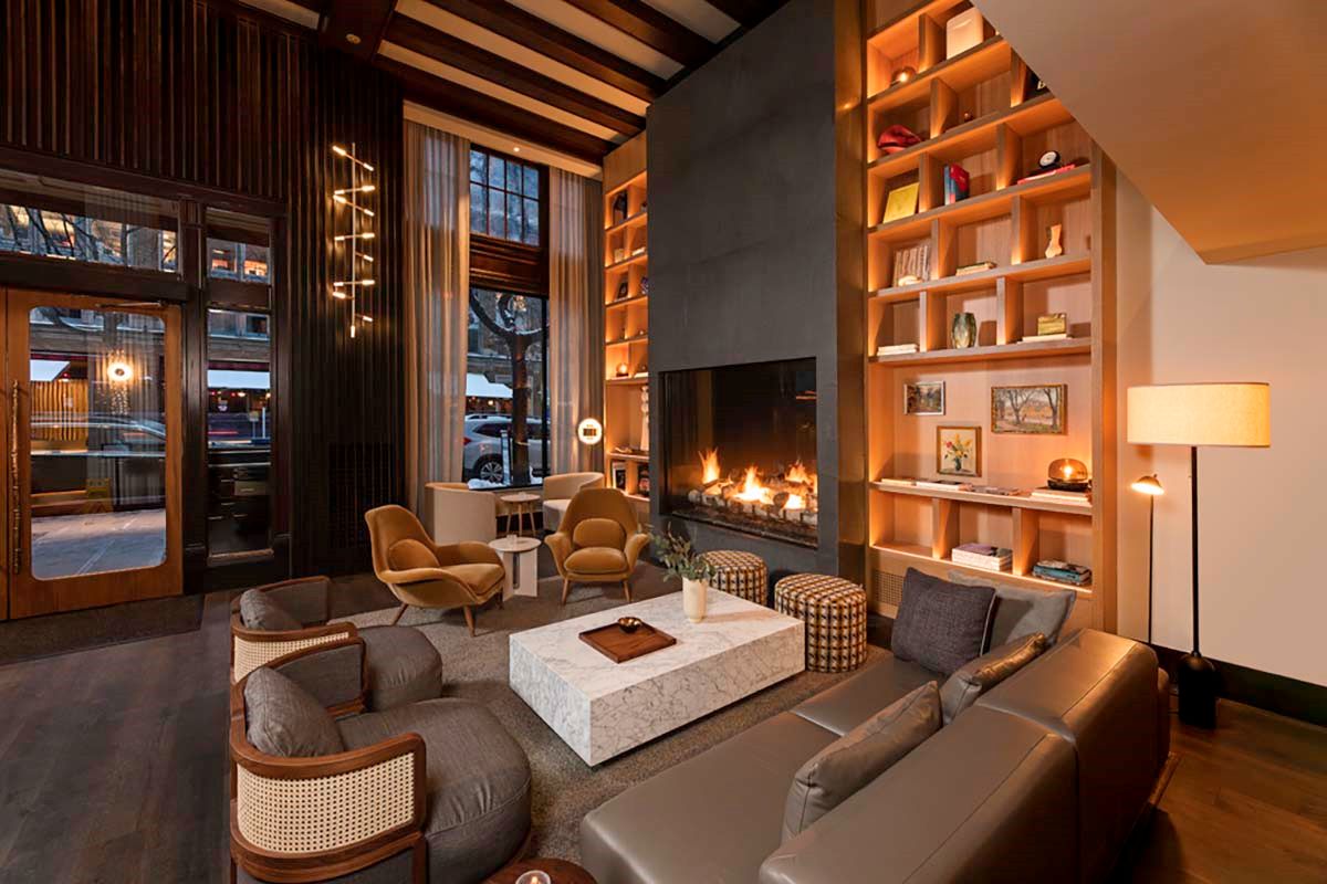 a room with a fireplace and couches