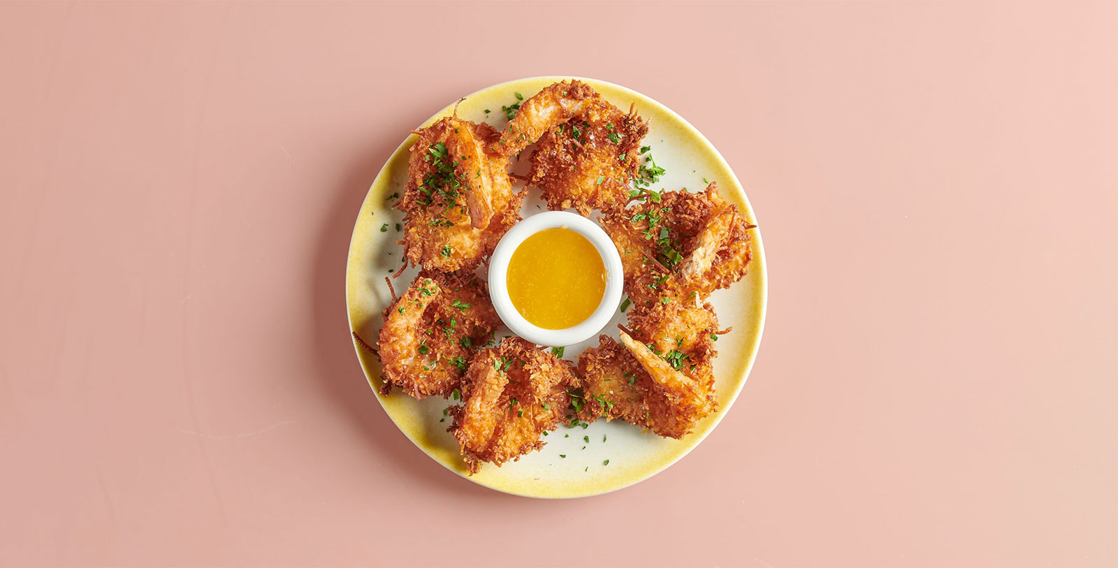 a plate of fried shrimp with sauce
