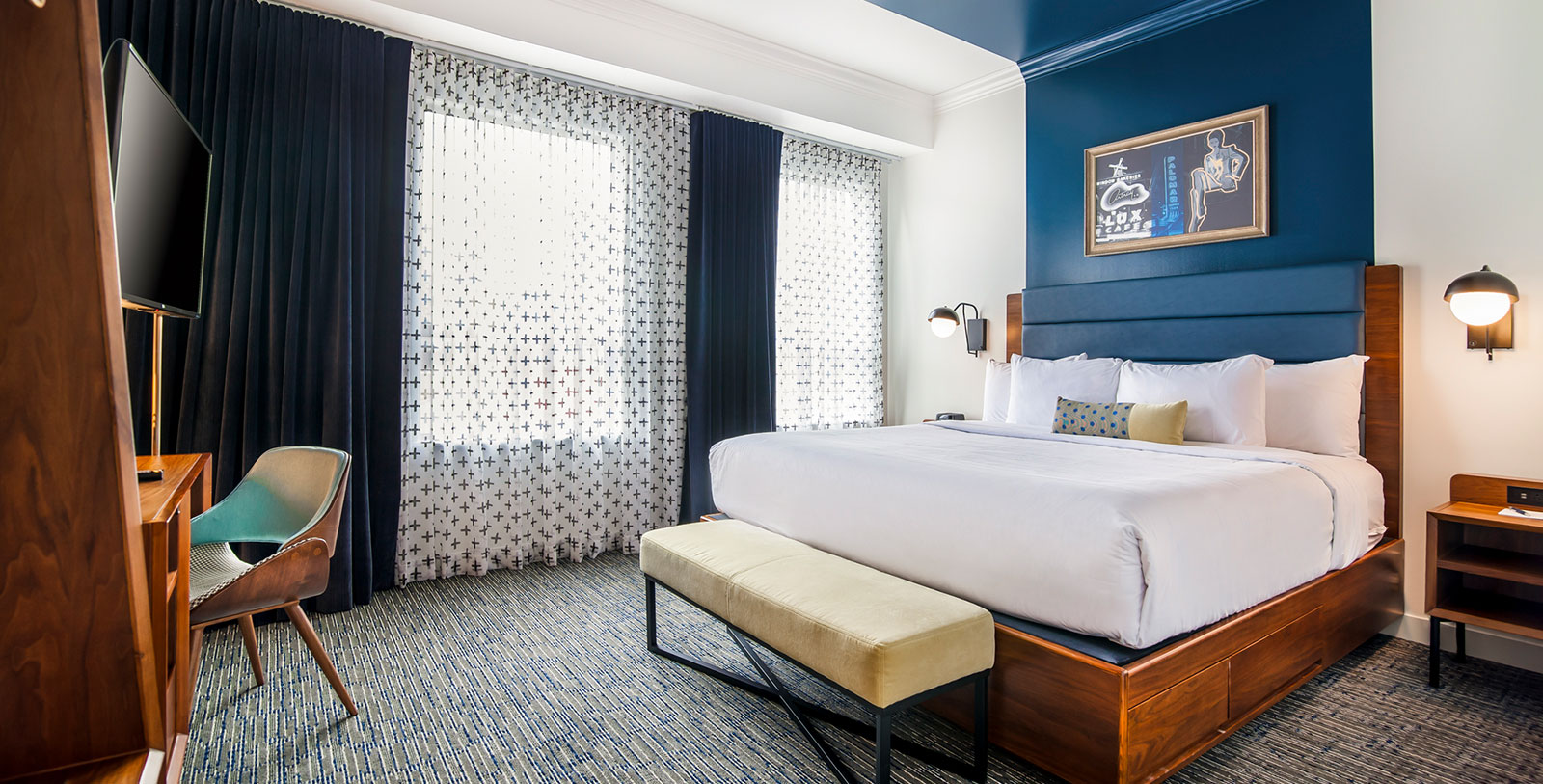 a room with a bed and a bench