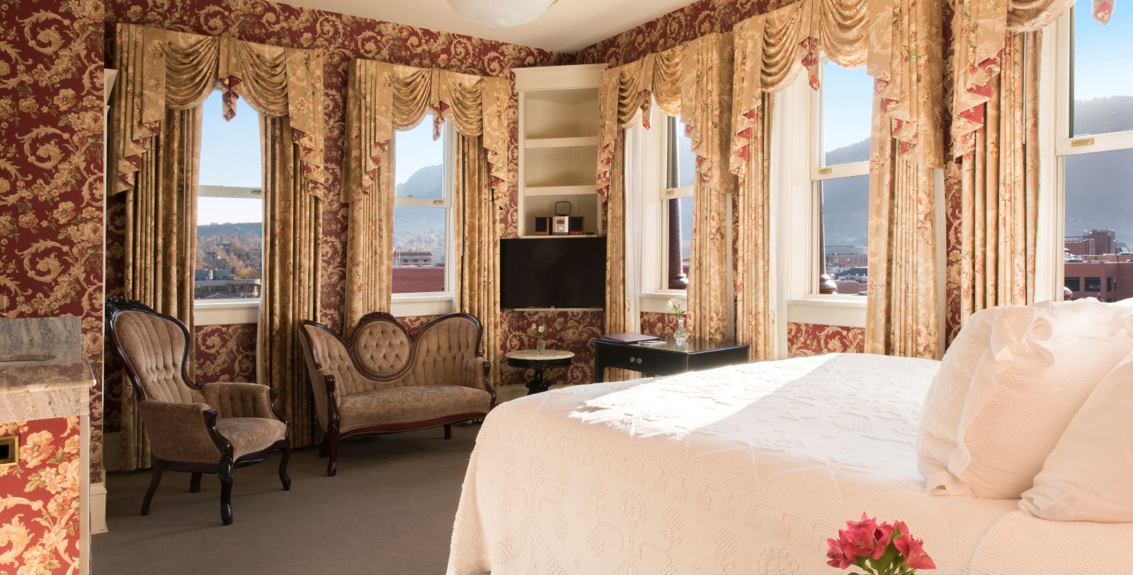 a bedroom with a bed and a couch