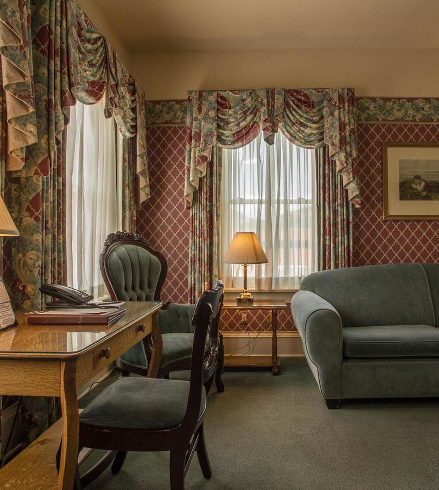 a room with a couch and a desk