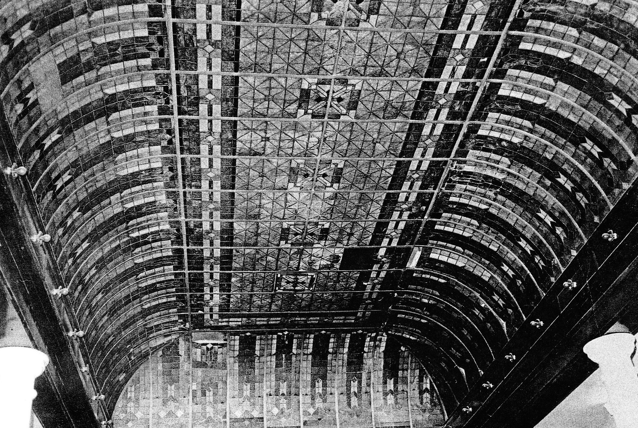 a black and white photo of a ceiling