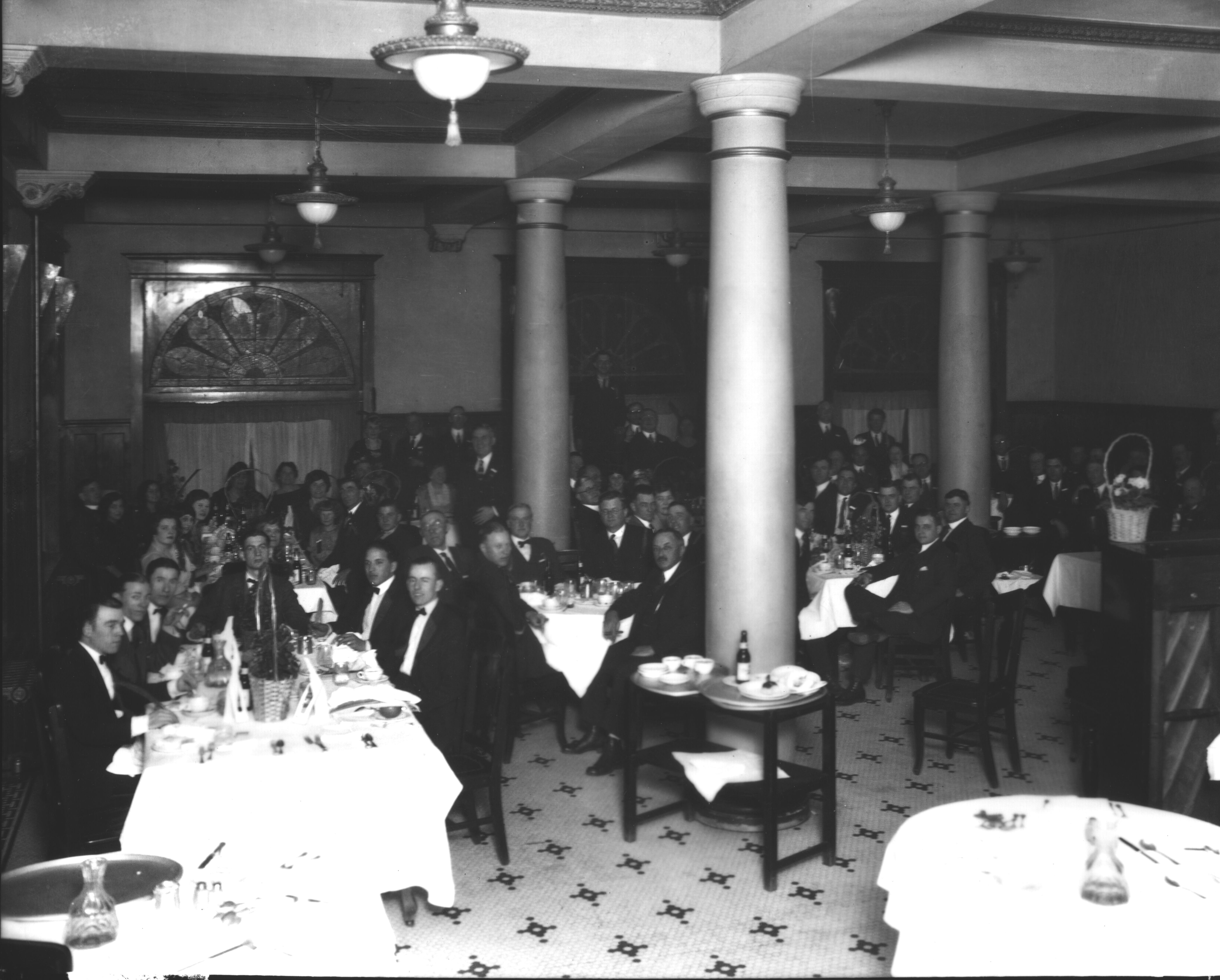 a group of people sitting at tables