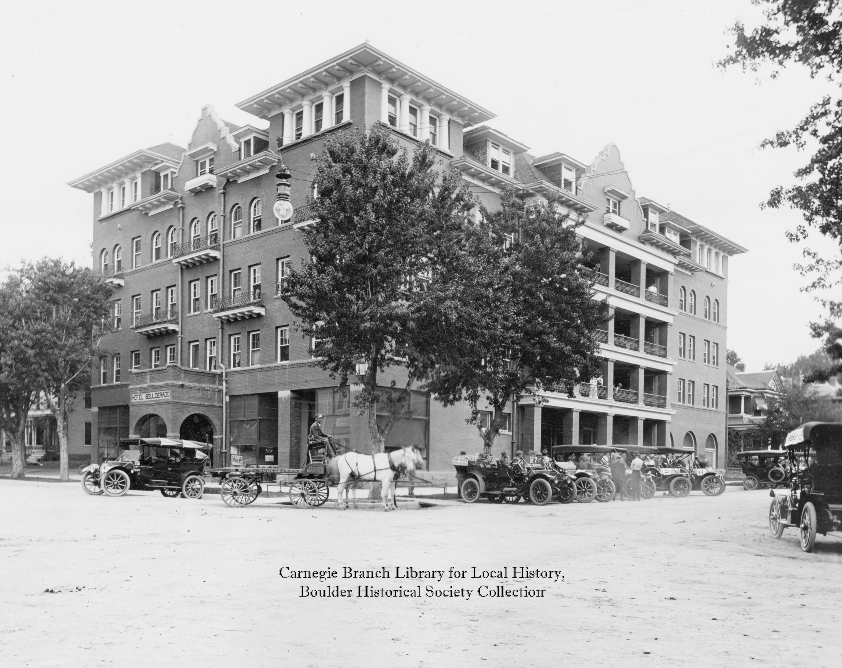 a horse drawn carriages in front of a building